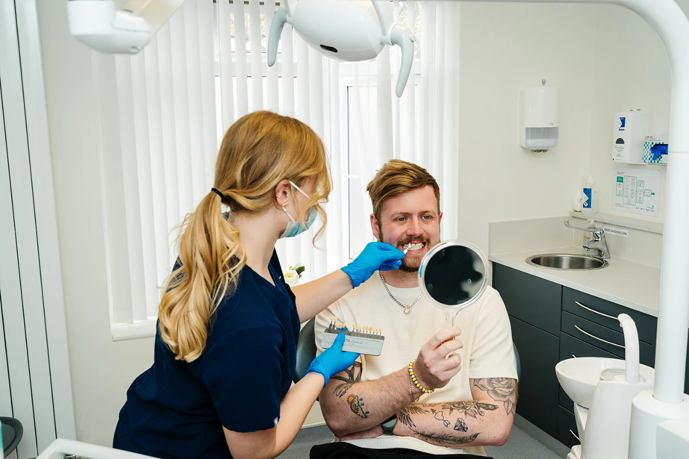 Dental patient testing veneer shades at Toftwood Dental Practice